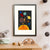 A brown monkey holds on to a red kite among the sun, stars and planets in space (A3 framed with white mount)