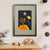 A brown monkey holds on to a red kite among the sun, stars and planets in space (A3 framed with grey mount)