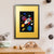 A grey bunny looks out of the window of a red, white and blue rocket, as it flies through space amongst colourful planets, stars and comets (A3 framed with gold mount)